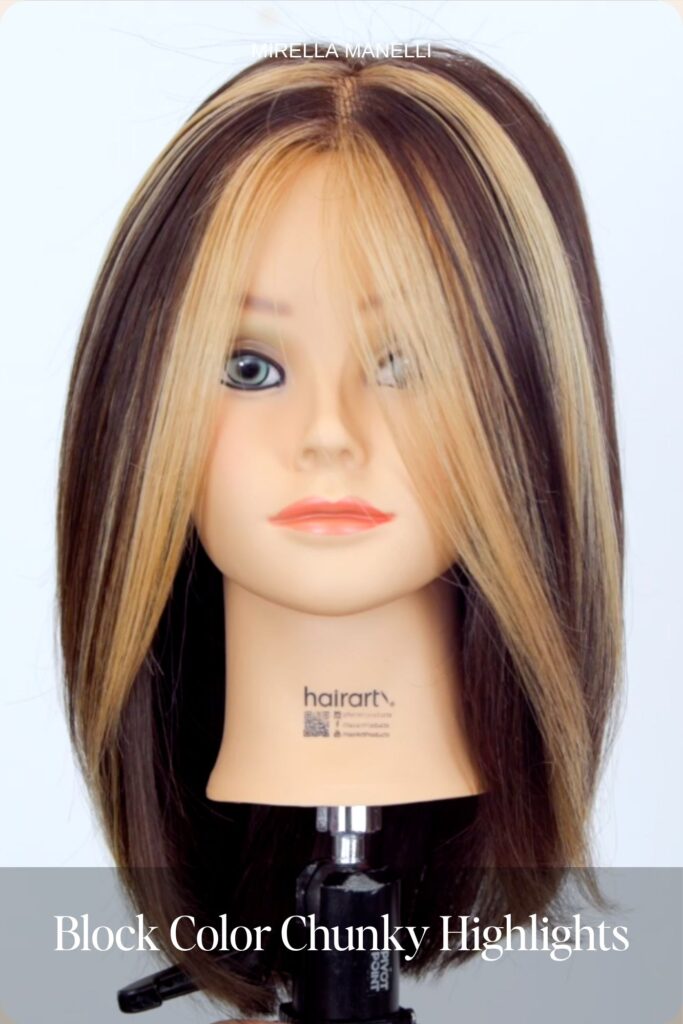 Block color chunky blonde and burgundy highlights on a mannequin