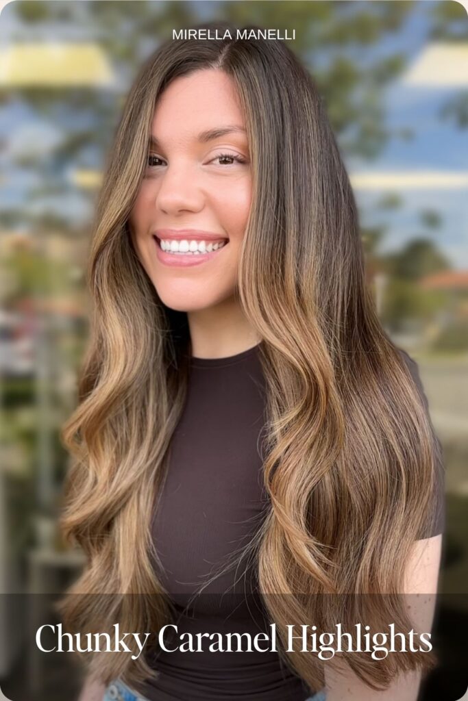 Chunky caramel highlights on long brown hair