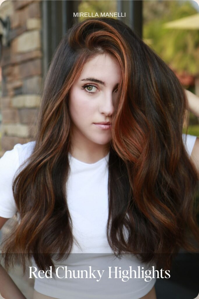 Chunky copper red highlights on dark brown hair